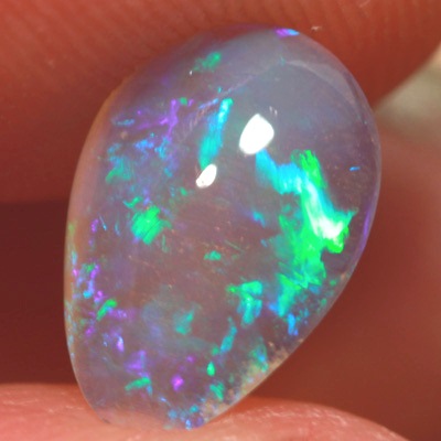 SOLID CRYSTAL OPAL Rolling flashes of green play in a 3D pattern 